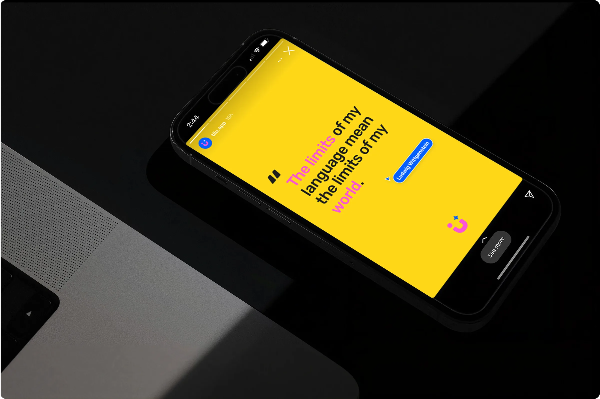 Tilu Instagram story mockup on a phone resting on a desk: 'The limits of my language mean the limits of my world'