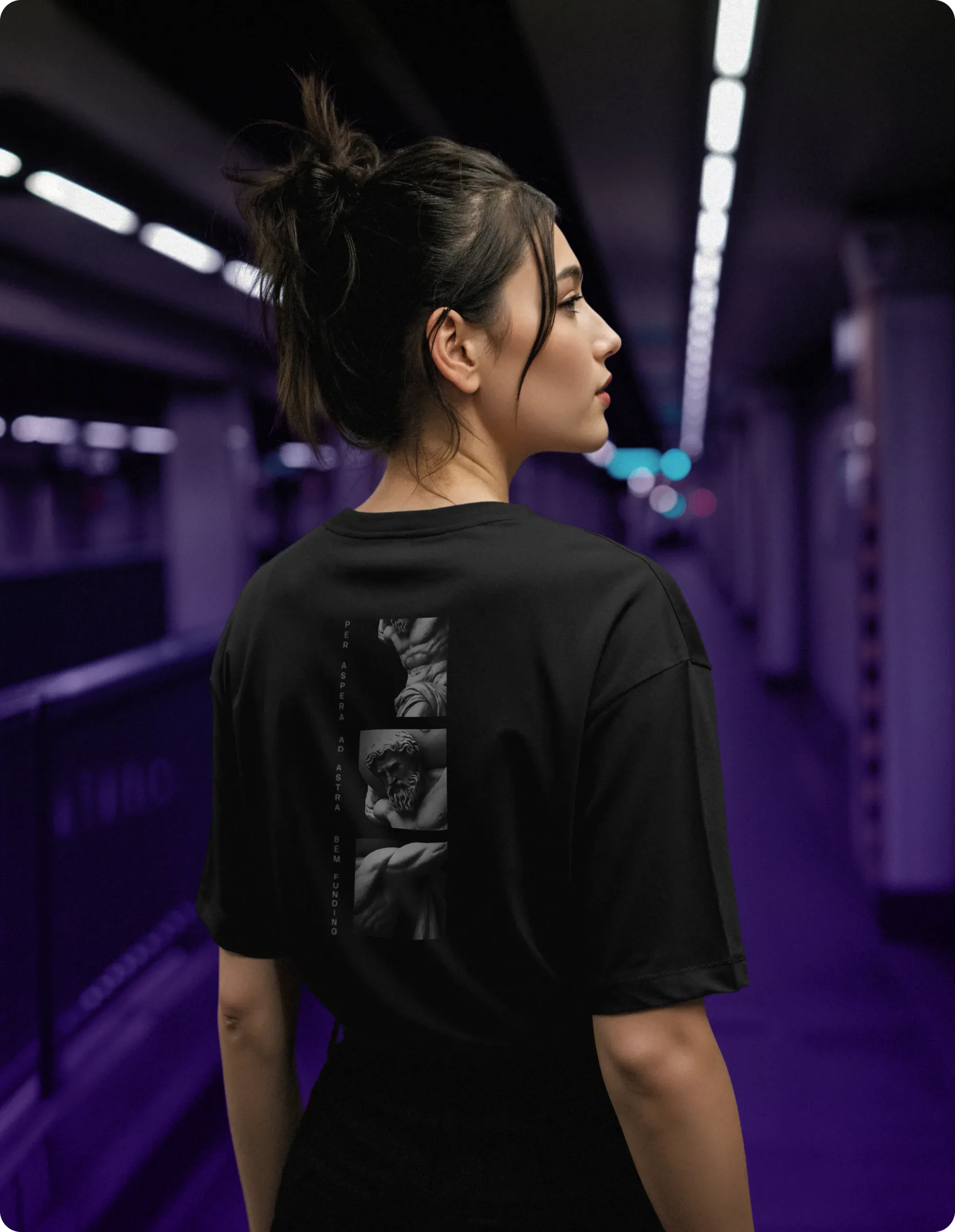 Lifestyle photo: a woman in a BEM-branded T-shirt on a subway platform