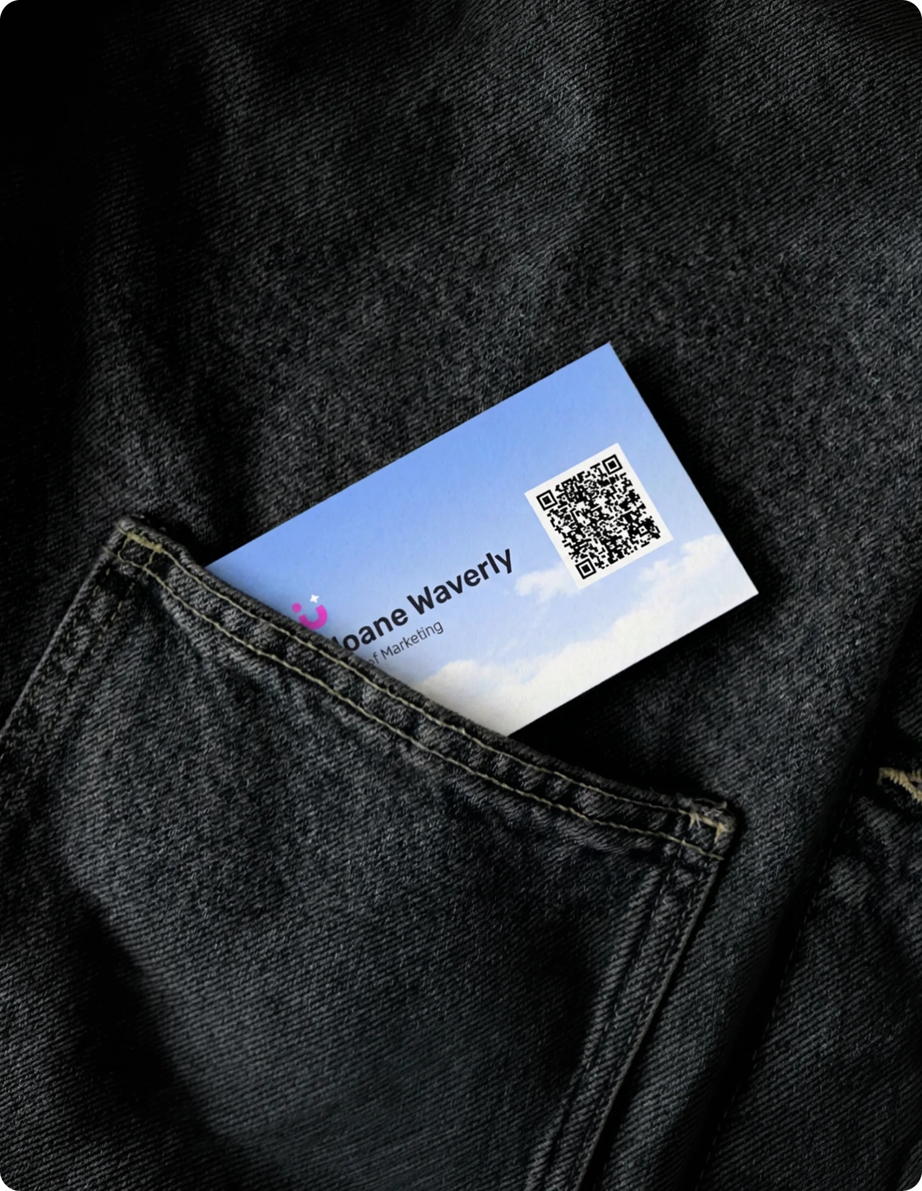 Tilu business card and QR code tucked in a jeans pocket