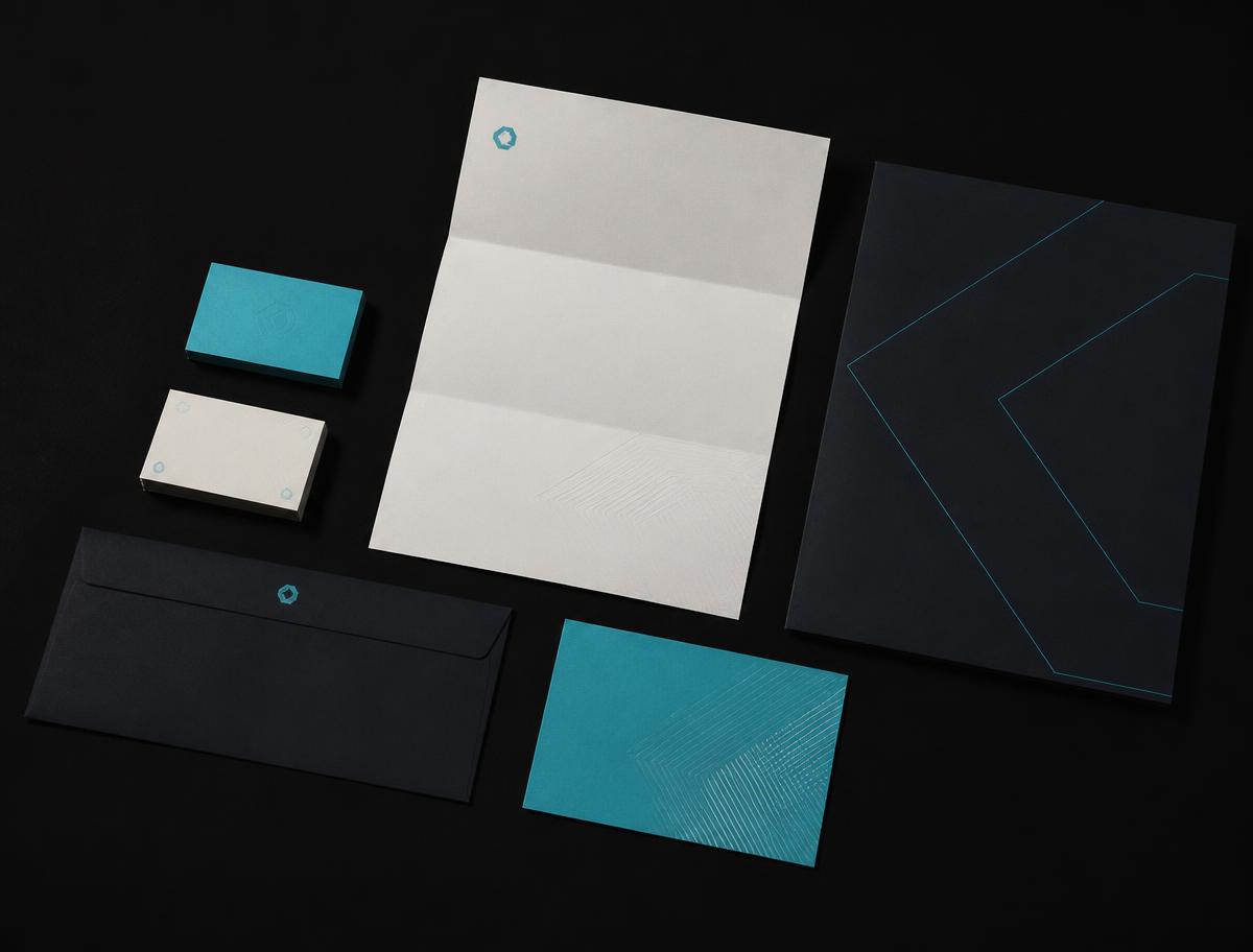 Obol printed stationery system arranged on a black surface