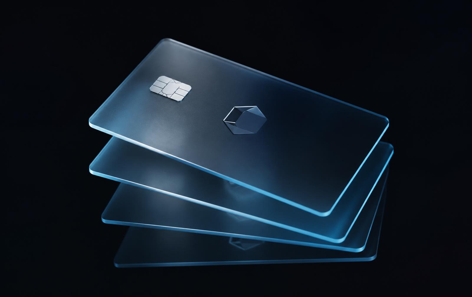 Translucent frosted Obol payment cards floating against black